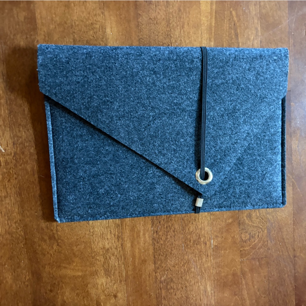 Grey felt MacBook Air sleeve with elastic closure and pocket